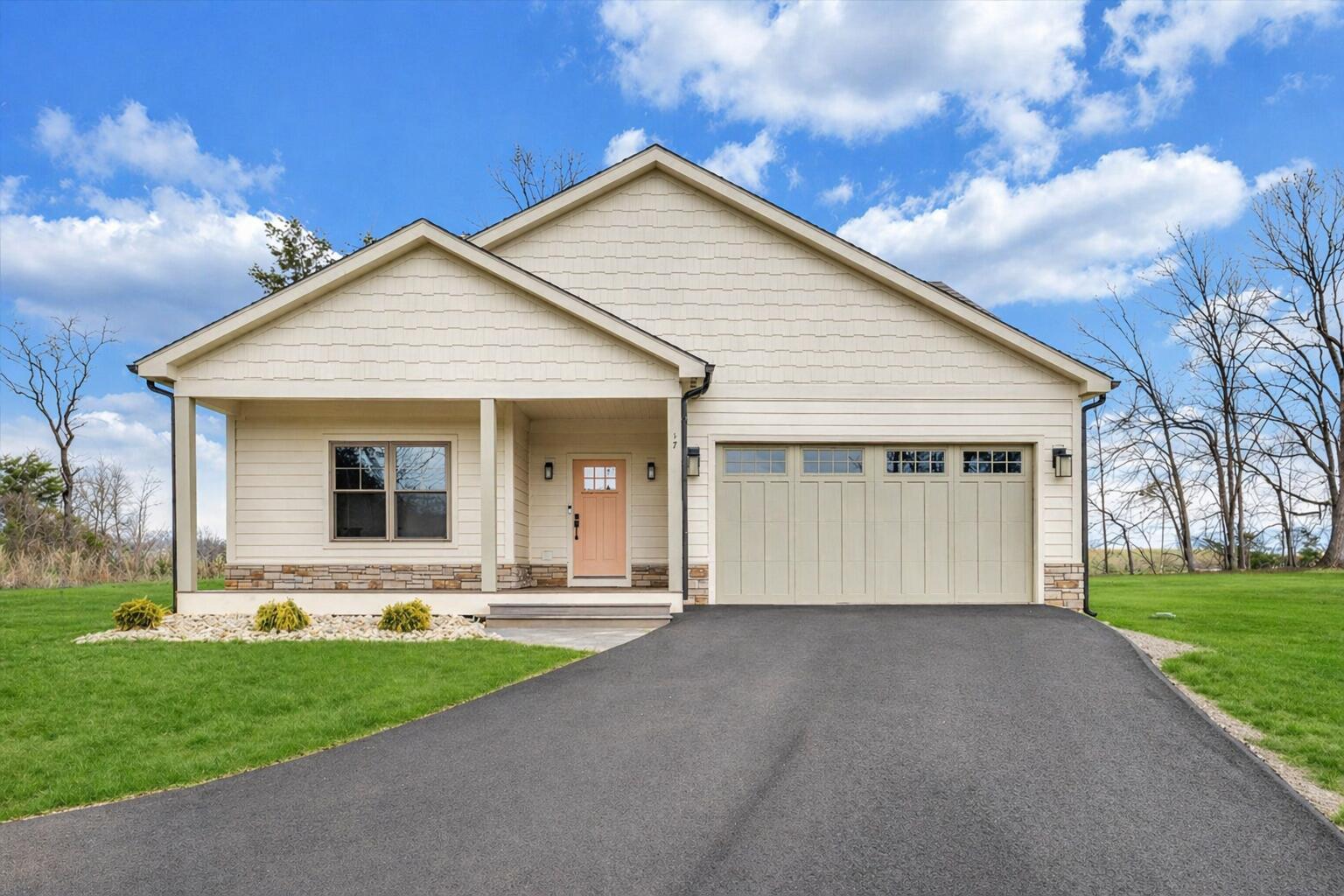 17 Alpine Drive Union Hall, VA 24176 - Photo 2 of 39 a front view of a house with a yard and garage