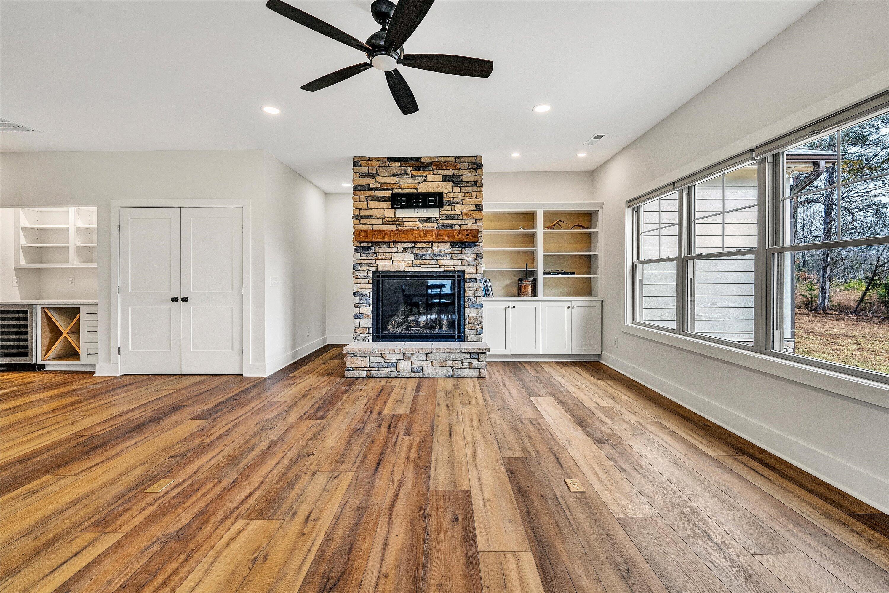 17 Alpine Drive Union Hall, VA 24176 - Photo 21 of 39 an empty room with wooden floor a ceiling fan and windows