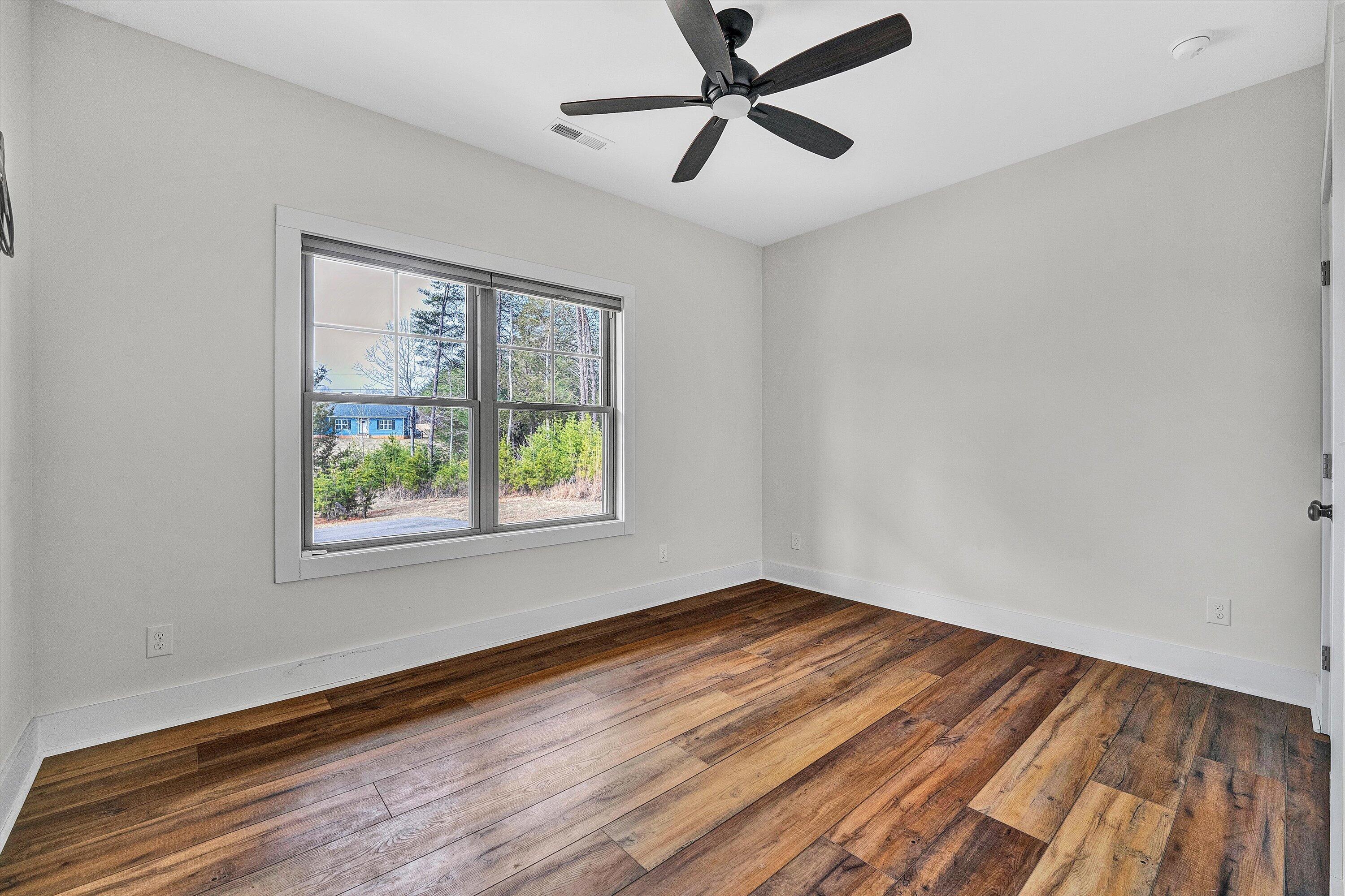 17 Alpine Drive Union Hall, VA 24176 - Photo 29 of 39 a view of empty room with wooden floor and fan