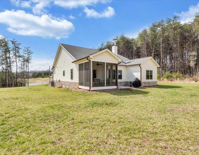 17 Alpine Drive Union Hall, VA 24176 - Photo 33 of 35 a front view of a house with a garden and trees