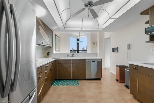 a kitchen with cabinets a sink and appliances