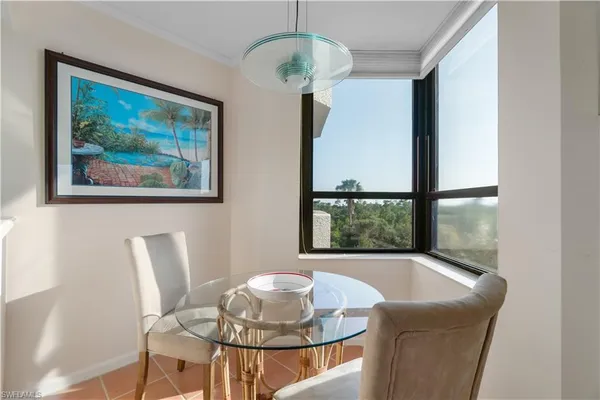 a dining room with furniture and window