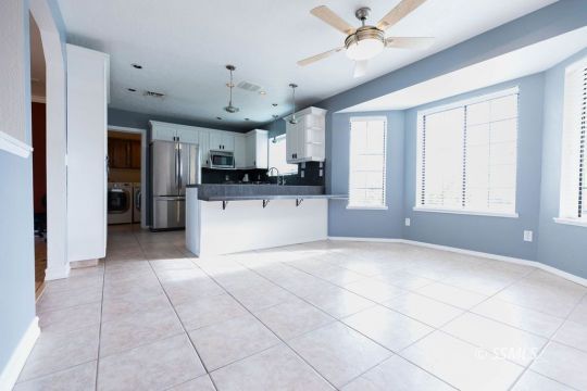 816 West Wasp Avenue Ridgecrest, CA 93555 - Photo 7 of 43 a large kitchen with cabinets and stainless steel appliances