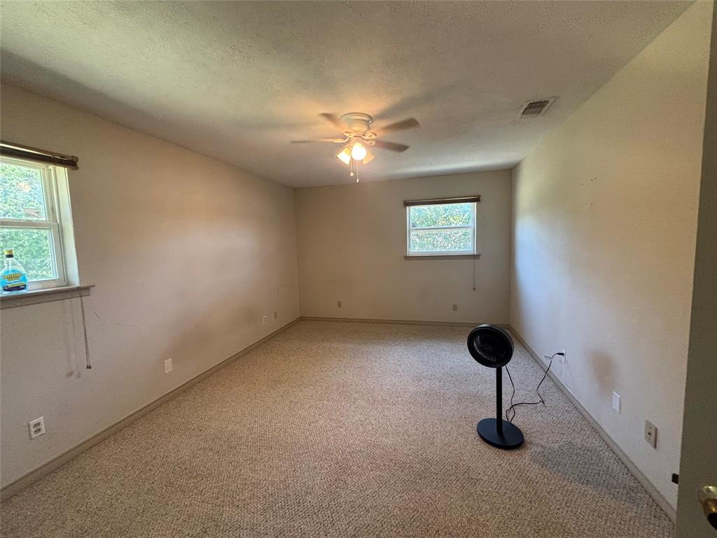 1910 Jefferson Street Commerce, TX 75428 - Photo 5 of 16 a view of an empty room with a window
