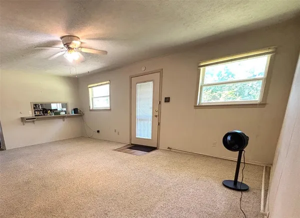 a view of an empty room with a window