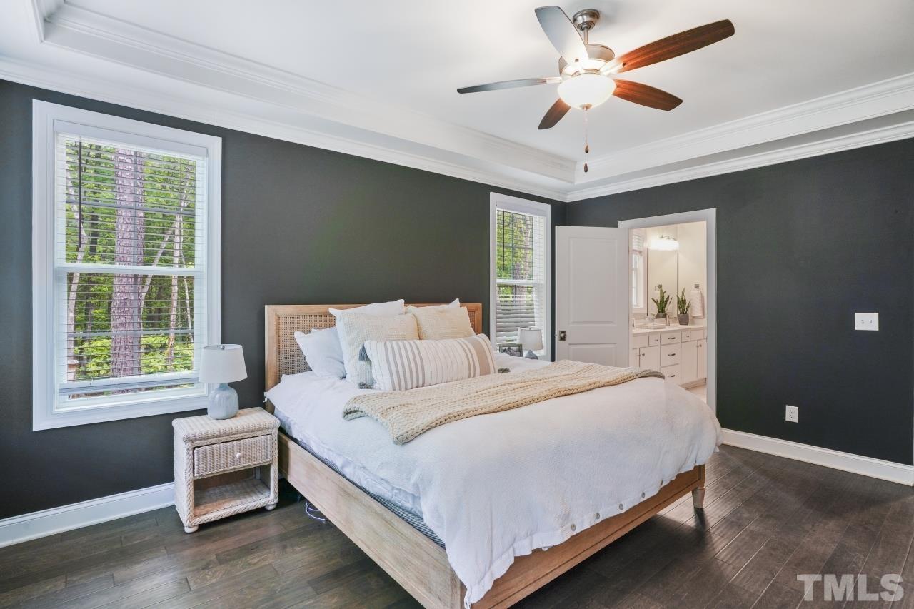 8600 Flannery Court Knightdale, NC 27545 - Photo 16 of 36 a bedroom with a bed and a large window