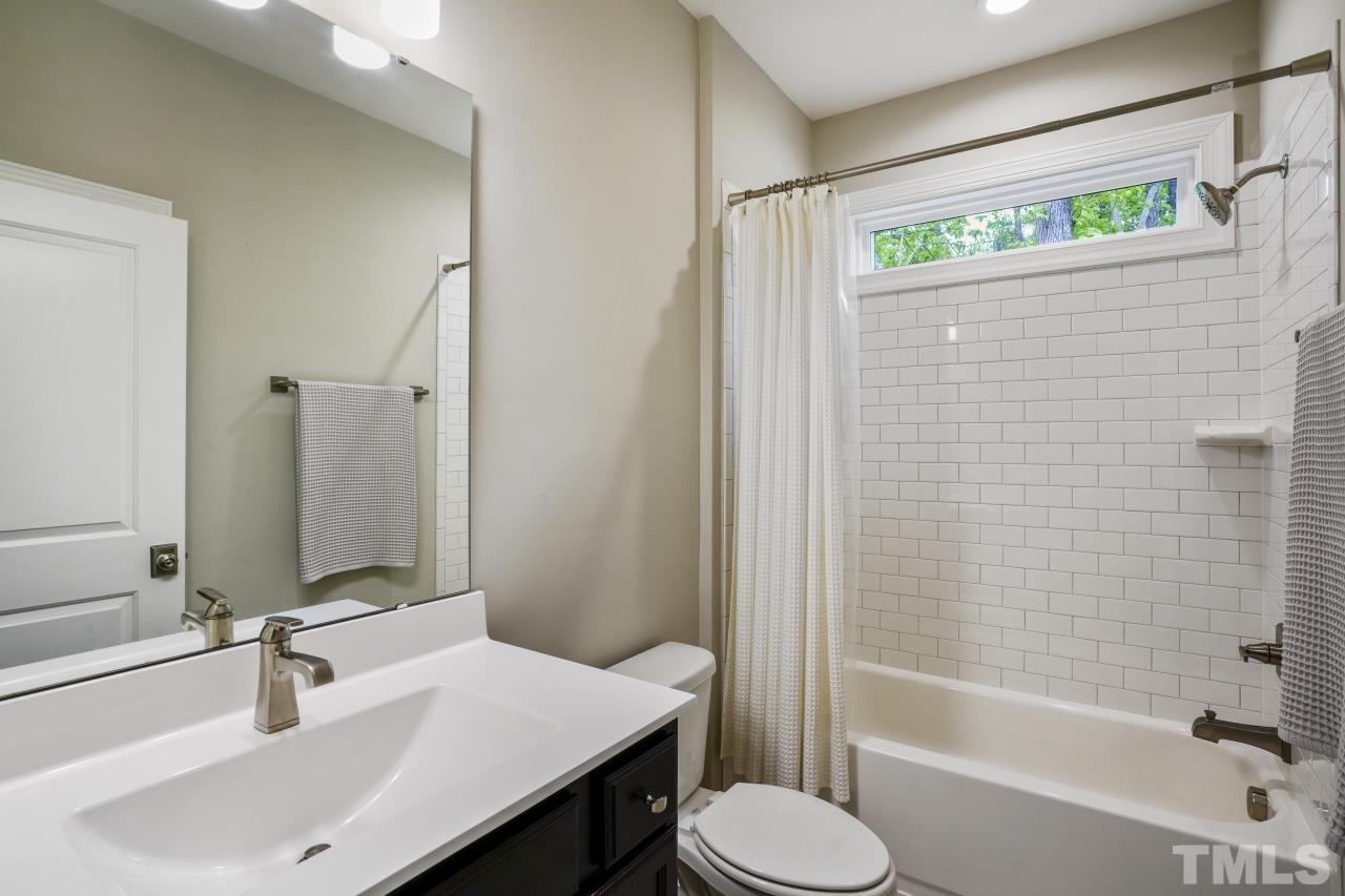 8600 Flannery Court Knightdale, NC 27545 - Photo 22 of 36 a bathroom with a sink toilet and shower