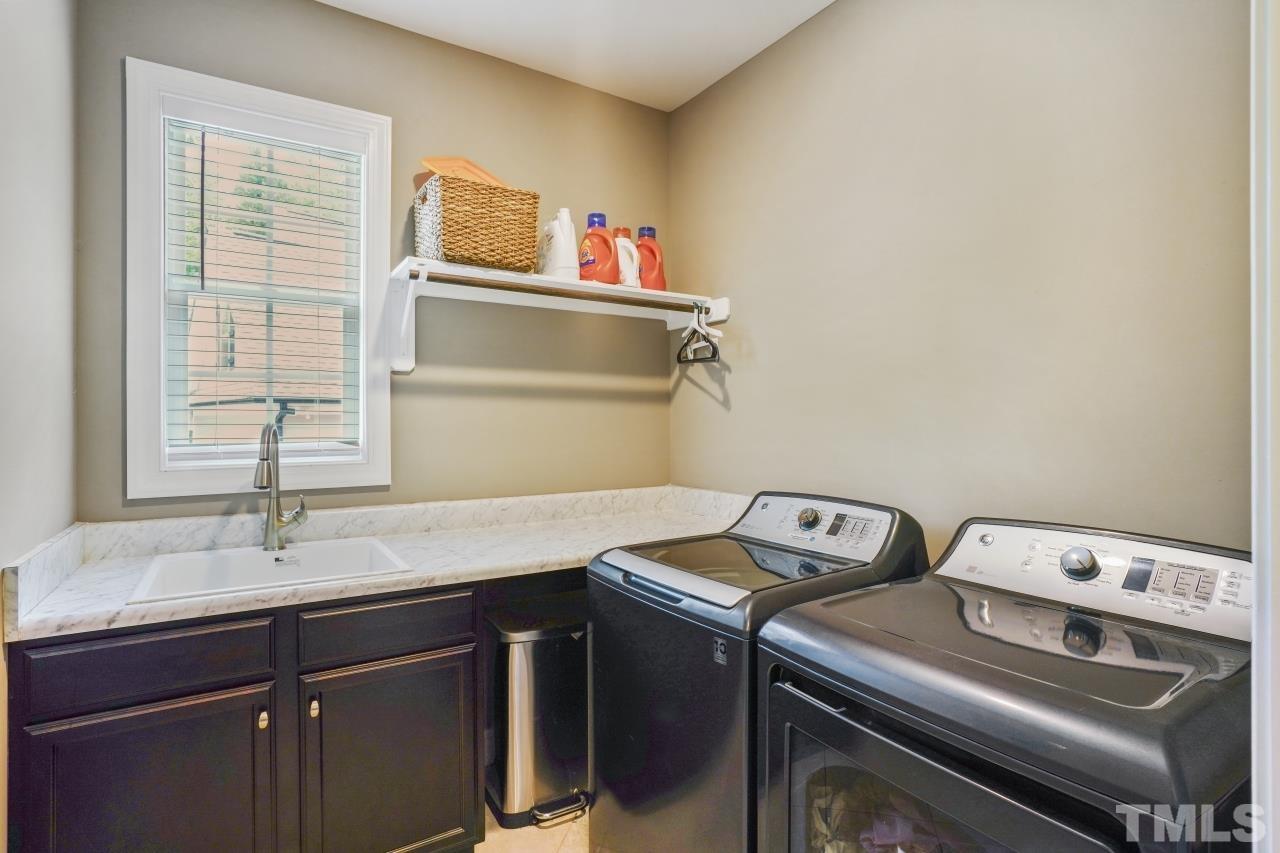 8600 Flannery Court Knightdale, NC 27545 - Photo 23 of 36 a utility room with dryer and washer