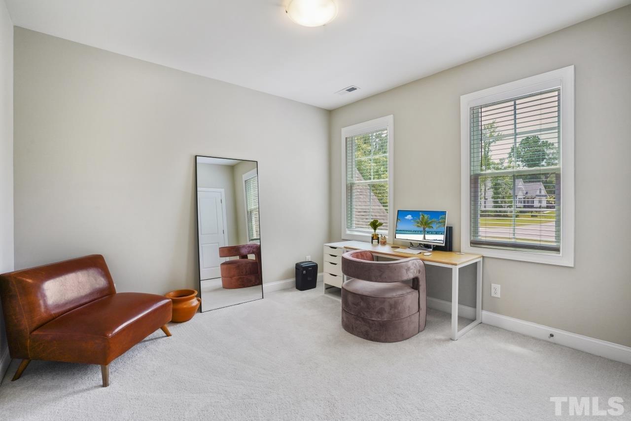 8600 Flannery Court Knightdale, NC 27545 - Photo 26 of 36 a living room with furniture and a window
