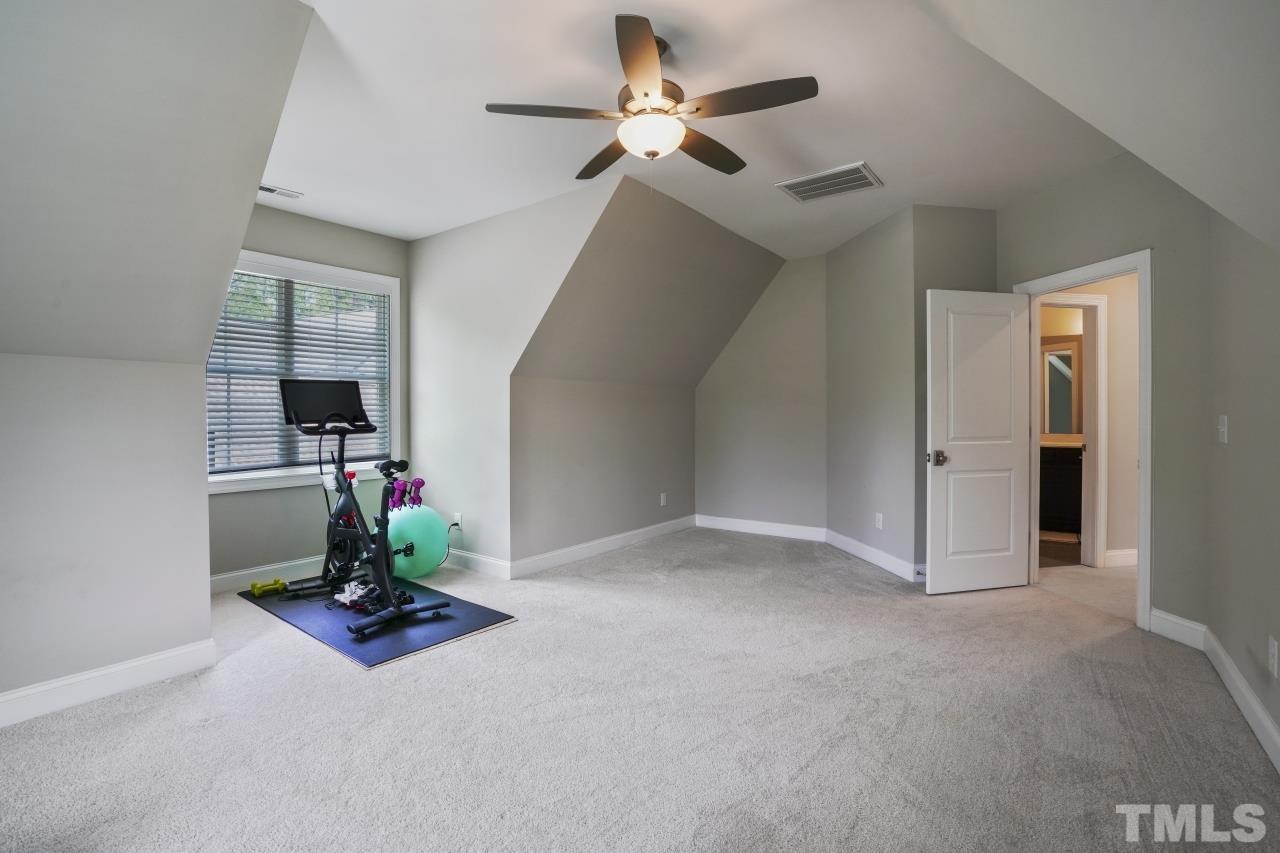 8600 Flannery Court Knightdale, NC 27545 - Photo 28 of 36 a living room with furniture and a fireplace