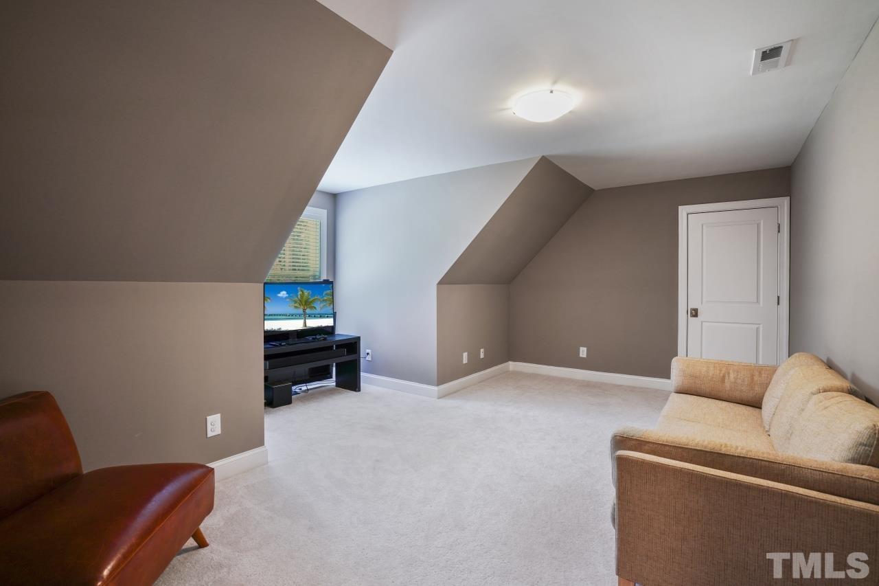 8600 Flannery Court Knightdale, NC 27545 - Photo 30 of 36 a living room with furniture and a couch
