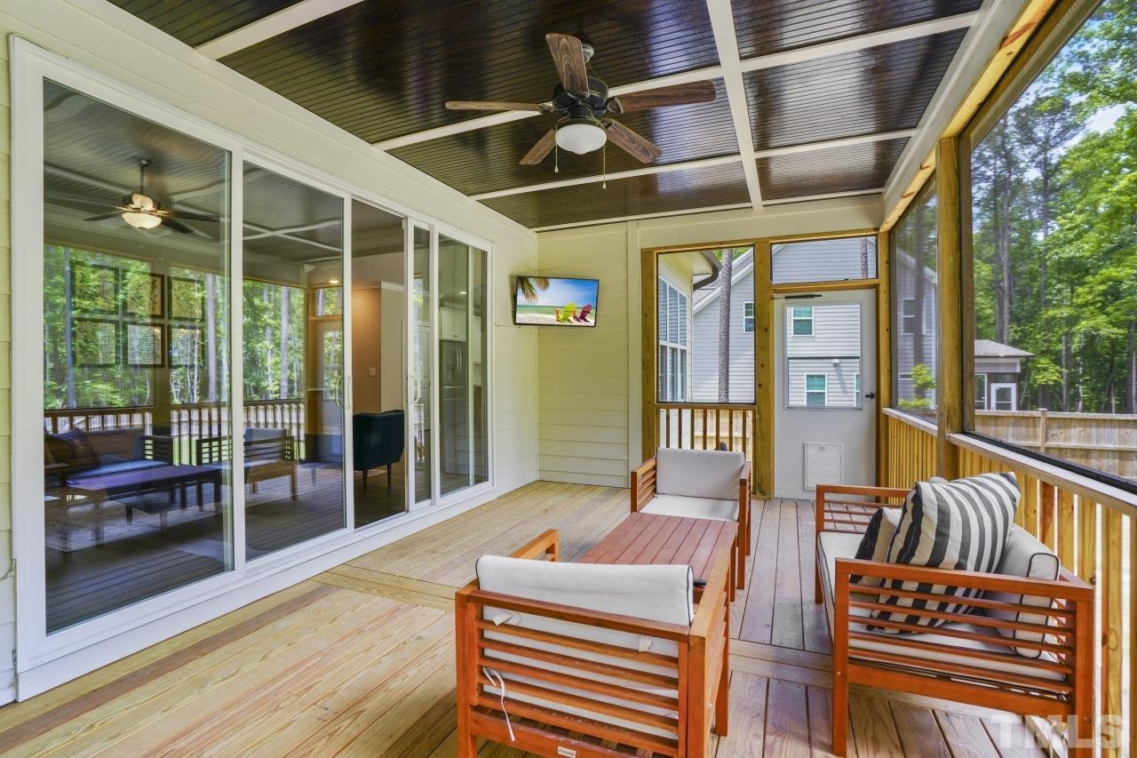 8600 Flannery Court Knightdale, NC 27545 - Photo 32 of 36 a balcony with furniture and a potted plant