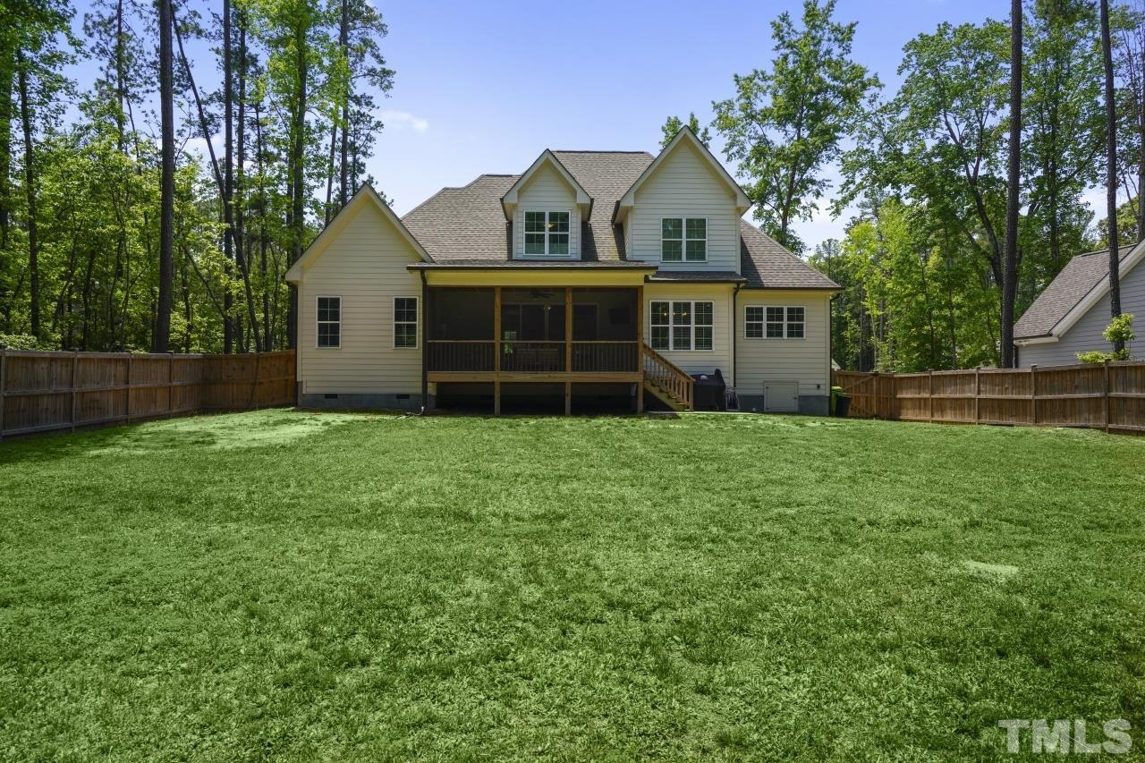 8600 Flannery Court Knightdale, NC 27545 - Photo 33 of 36 a front view of house with yard and green space