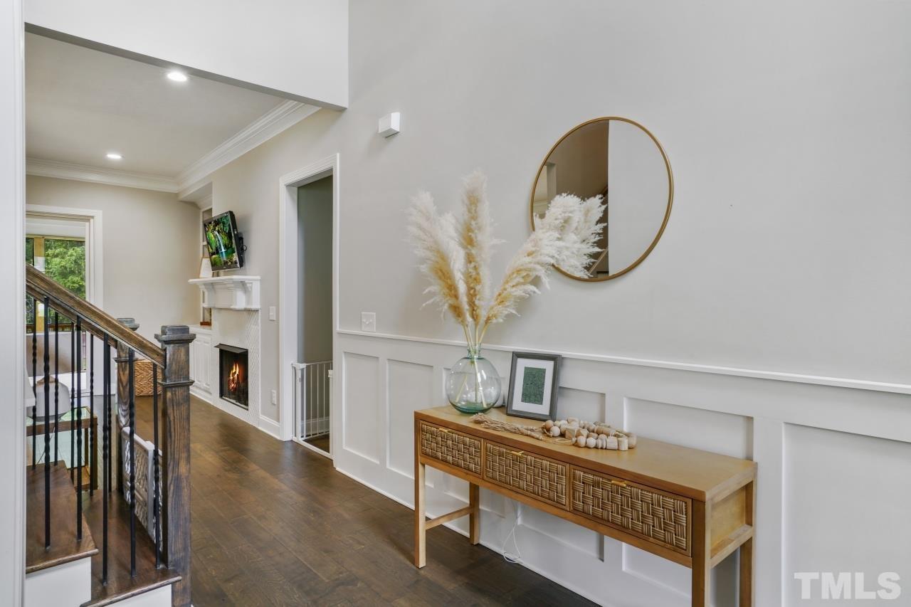 8600 Flannery Court Knightdale, NC 27545 - Photo 5 of 36 a view of a hallway with entryway wooden floor and front door