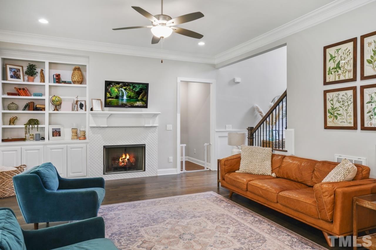 8600 Flannery Court Knightdale, NC 27545 - Photo 6 of 36 a living room with furniture and a fireplace