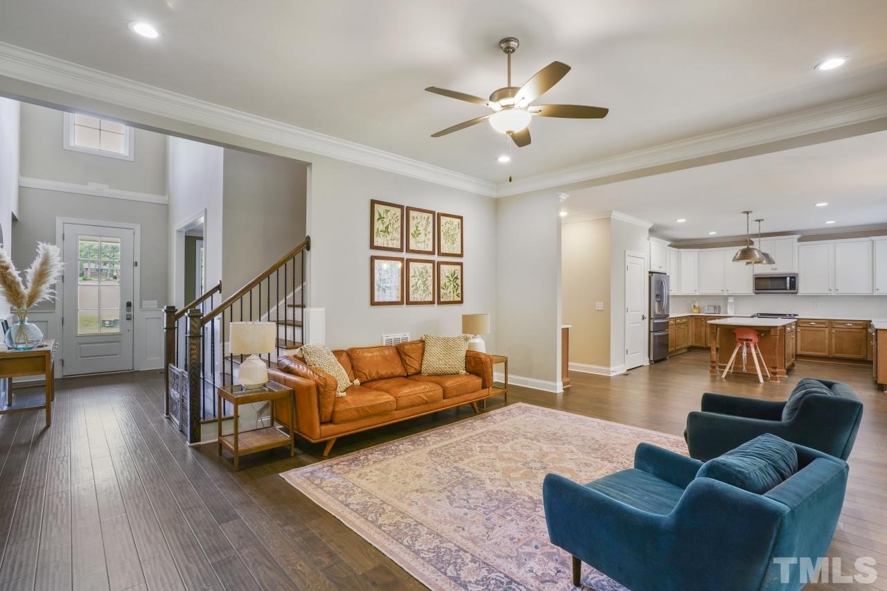 8600 Flannery Court Knightdale, NC 27545 - Photo 7 of 36 a living room with furniture kitchen view and a wooden floor