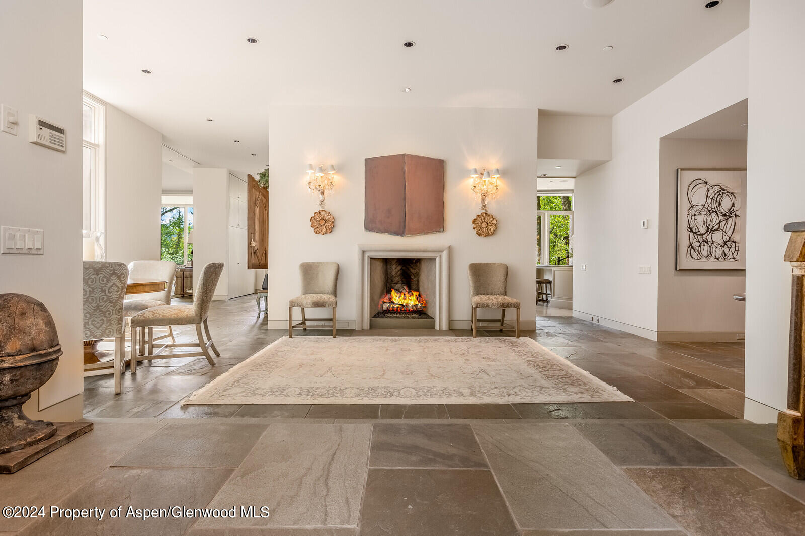 844 Roaring Fork Road Aspen, CO 81611 - Photo 18 of 39 a living room with furniture and a fireplace