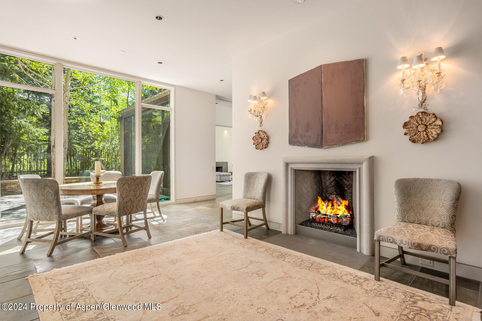 844 Roaring Fork Road Aspen, CO 81611 - Photo 19 of 39 a living room with furniture and a fireplace