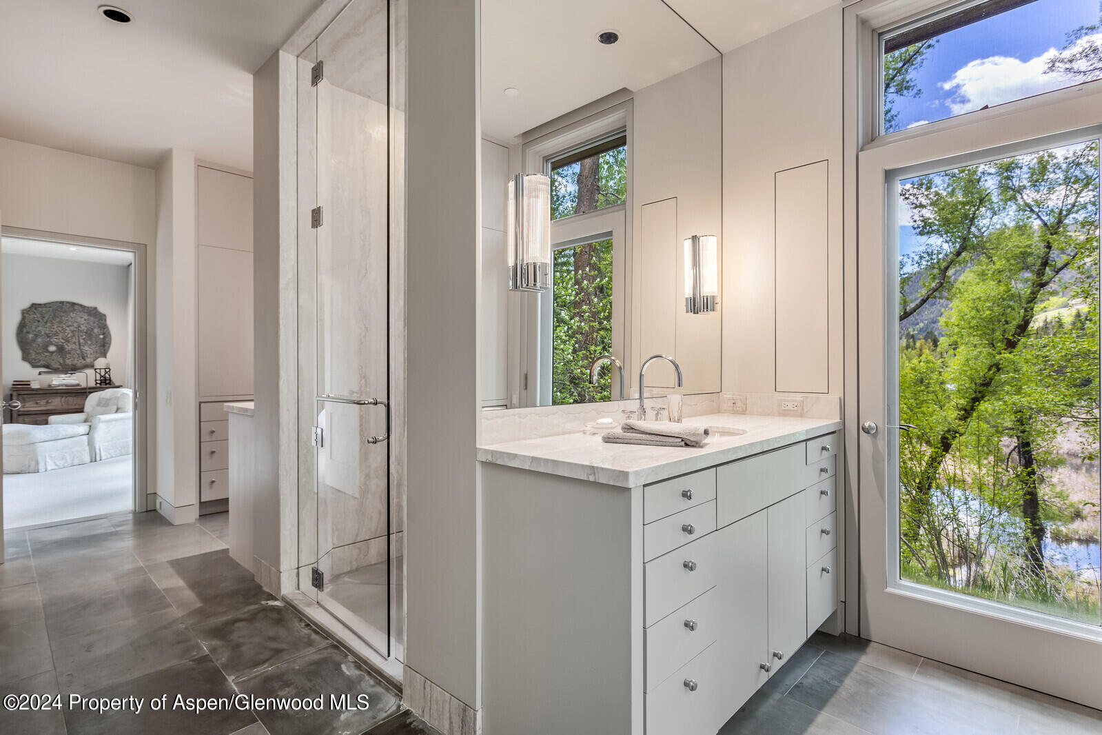 844 Roaring Fork Road Aspen, CO 81611 - Photo 27 of 39 a bathroom with a sink and a mirror
