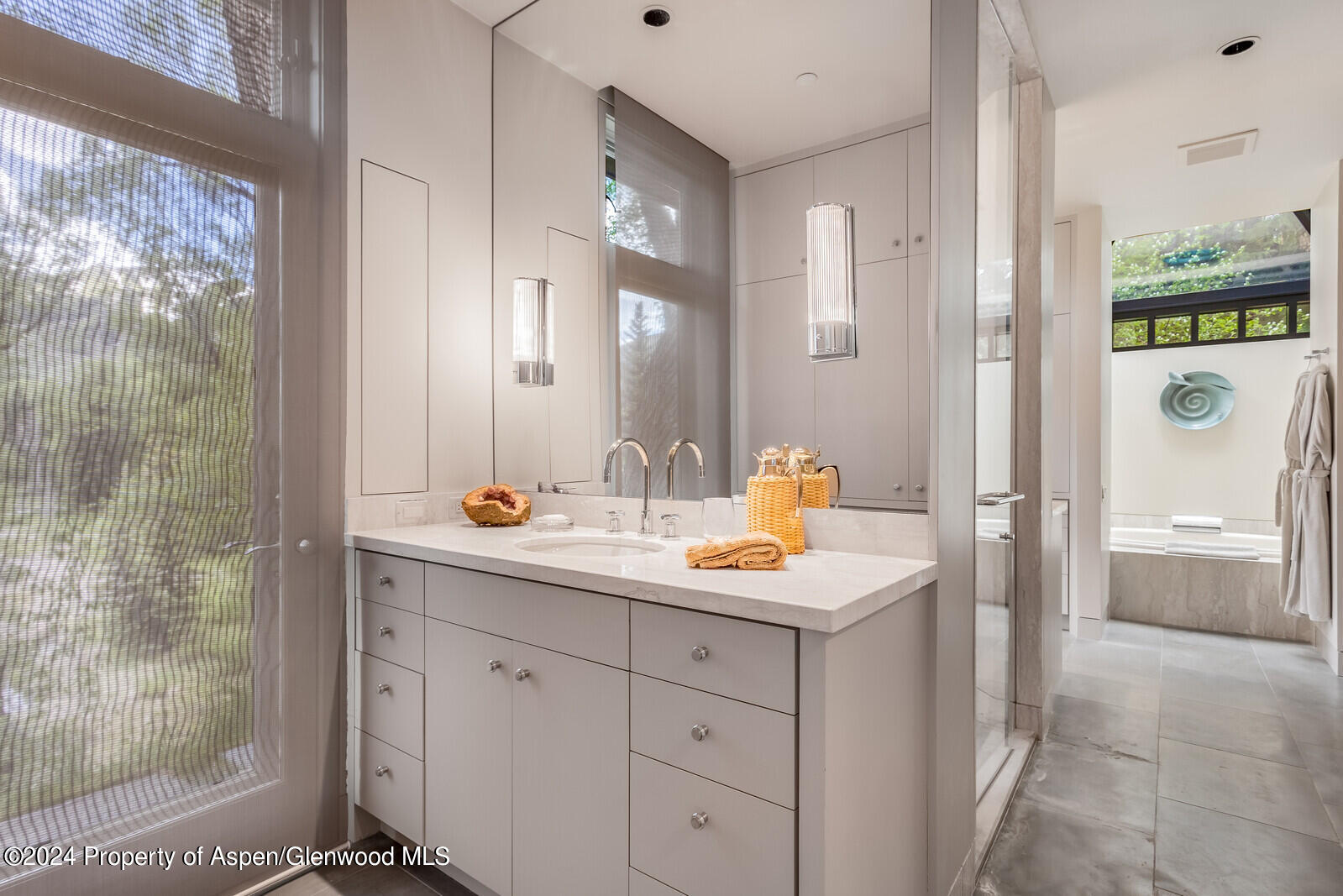 844 Roaring Fork Road Aspen, CO 81611 - Photo 29 of 39 a view of bathroom with a sink and mirror