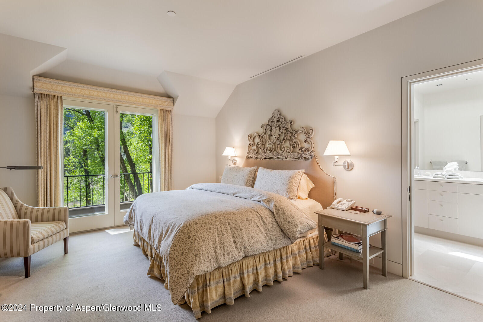 844 Roaring Fork Road Aspen, CO 81611 - Photo 34 of 39 a bedroom with a bed and a large window