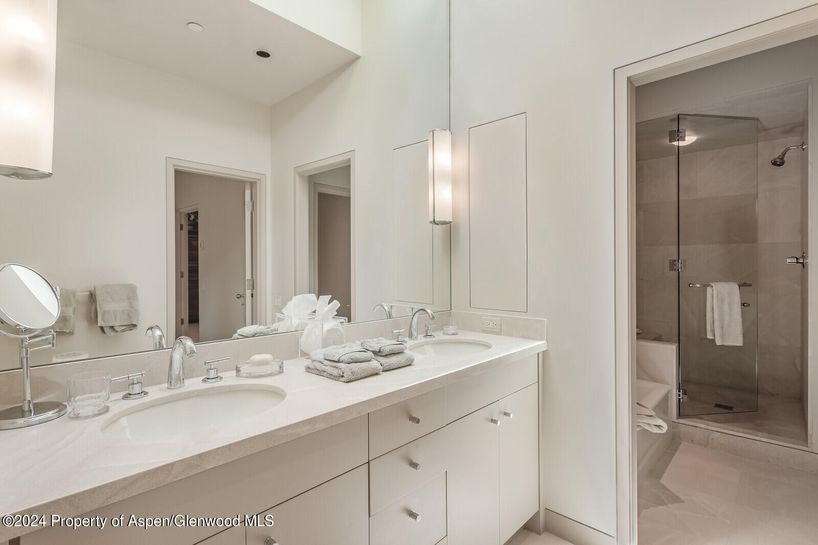 844 Roaring Fork Road Aspen, CO 81611 - Photo 35 of 39 a bathroom with double vanity sinks and a mirror