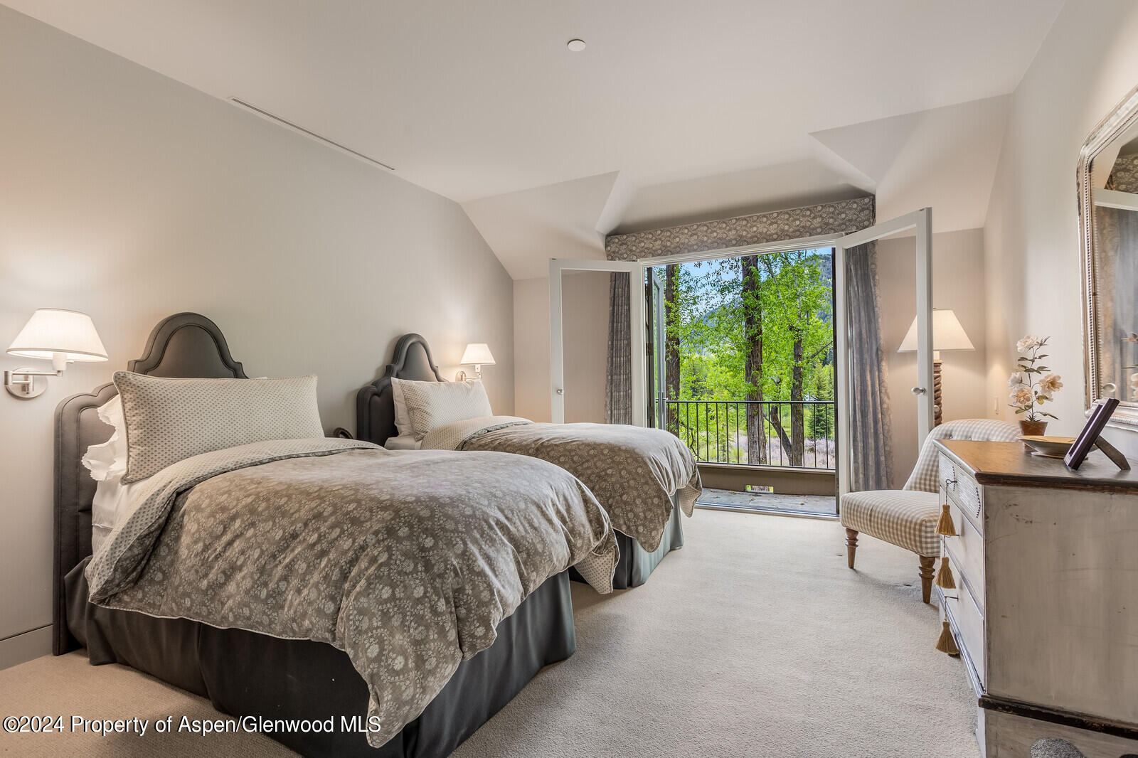 844 Roaring Fork Road Aspen, CO 81611 - Photo 36 of 39 a spacious bedroom with two beds and large windows