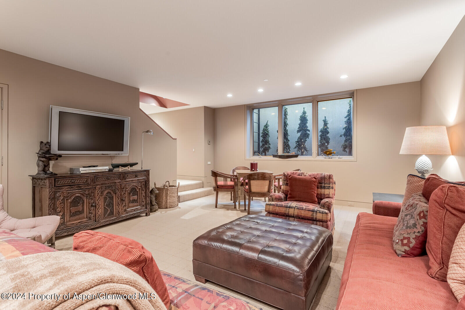 844 Roaring Fork Road Aspen, CO 81611 - Photo 38 of 39 a bedroom with furniture and a flat screen tv