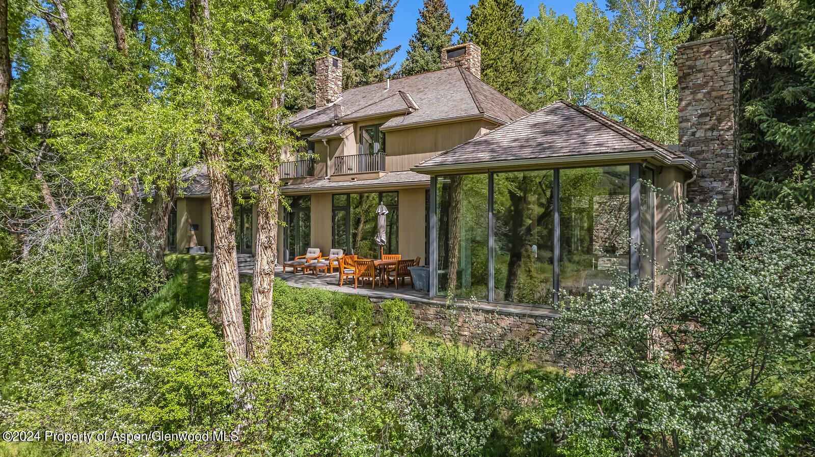 844 Roaring Fork Road Aspen, CO 81611 - Photo 4 of 39 a view of a house with backyard and porch