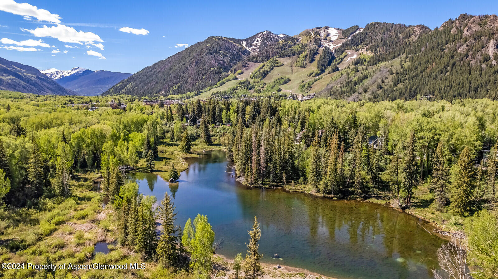 844 Roaring Fork Road Aspen, CO 81611 - Photo 5 of 39 a view of a swimming pool with an outdoor space and seating area