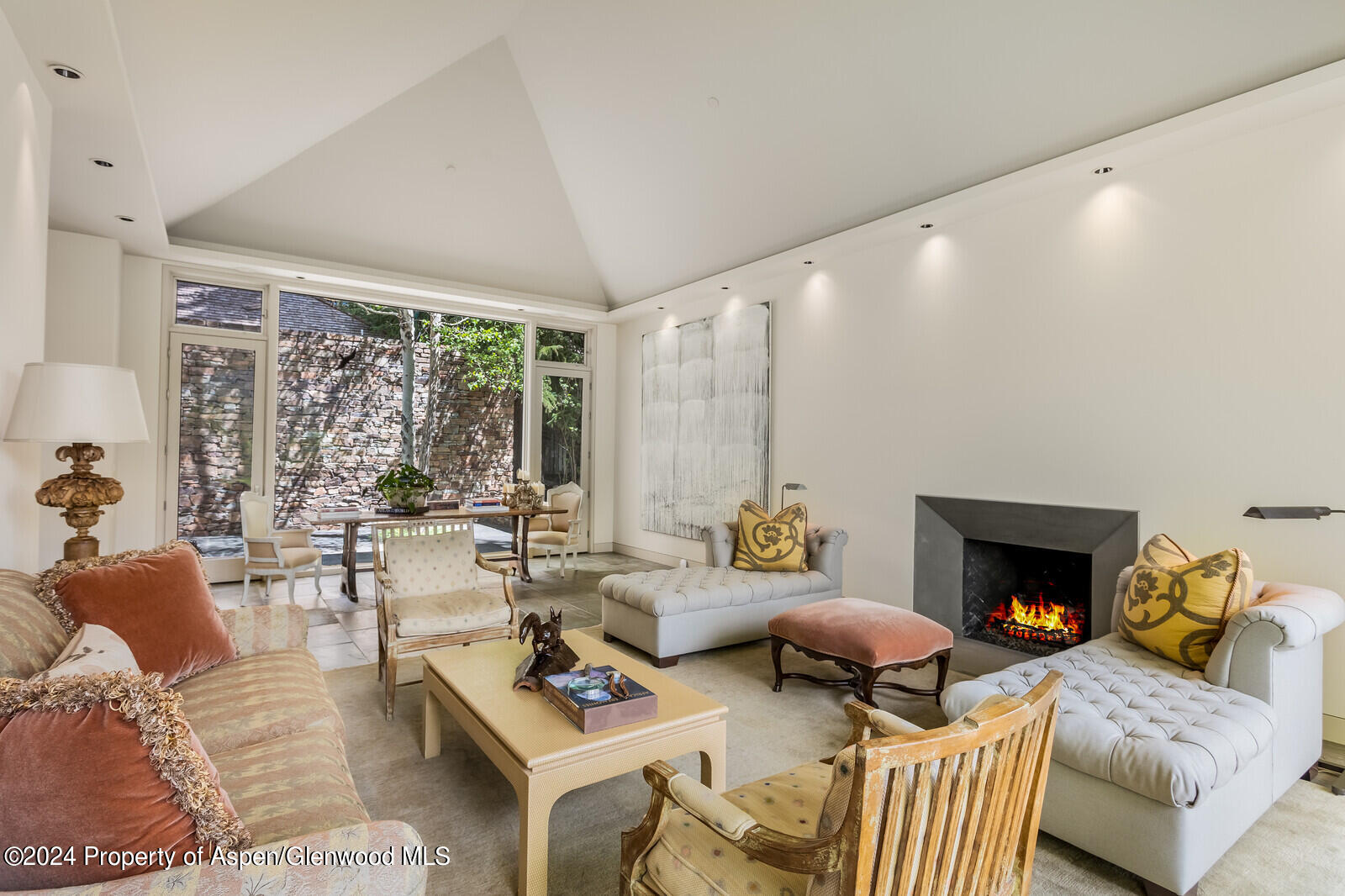 844 Roaring Fork Road Aspen, CO 81611 - Photo 10 of 39 a living room with furniture and a fireplace