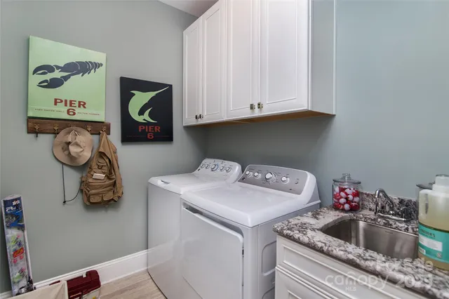 a kitchen with a sink and cabinets