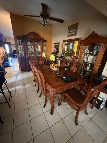 a room with gym equipment and a large window
