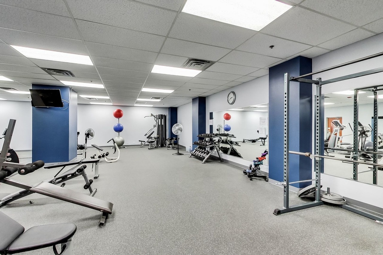 212 West Washington Street, Unit 1106 Chicago, IL 60606 - Photo 5 of 25 a view of a room with gym equipment