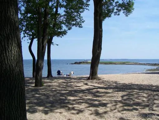 a view of an ocean beach and mountain