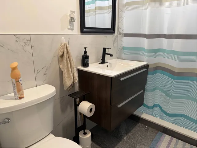 a kitchen with a table chairs and a window