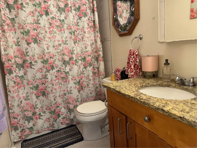 a kitchen with a refrigerator and a stove