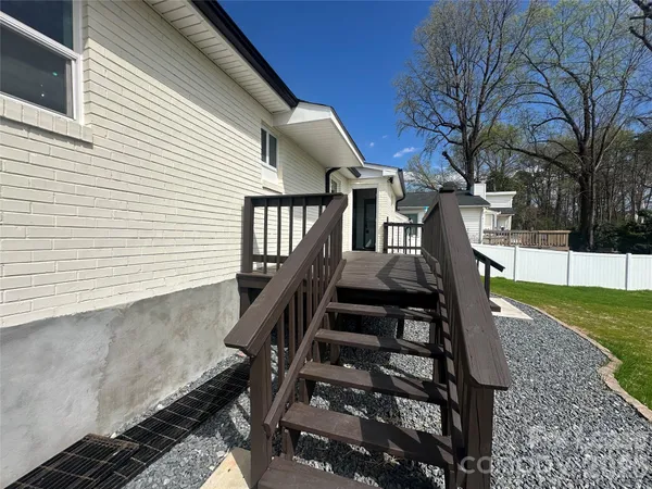 a view of an chairs and floor in the back yard