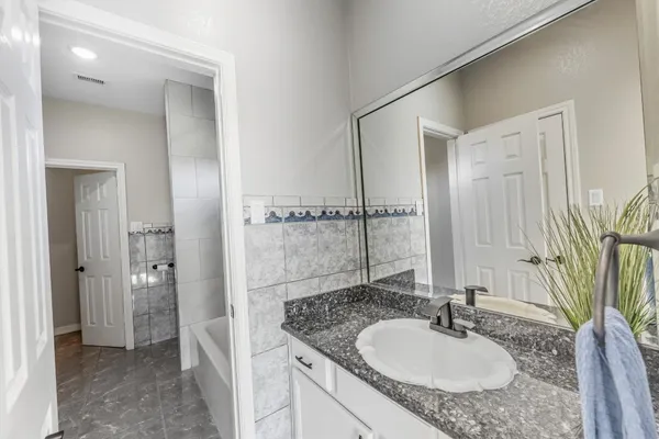 a bathroom with a bathtub and a shower