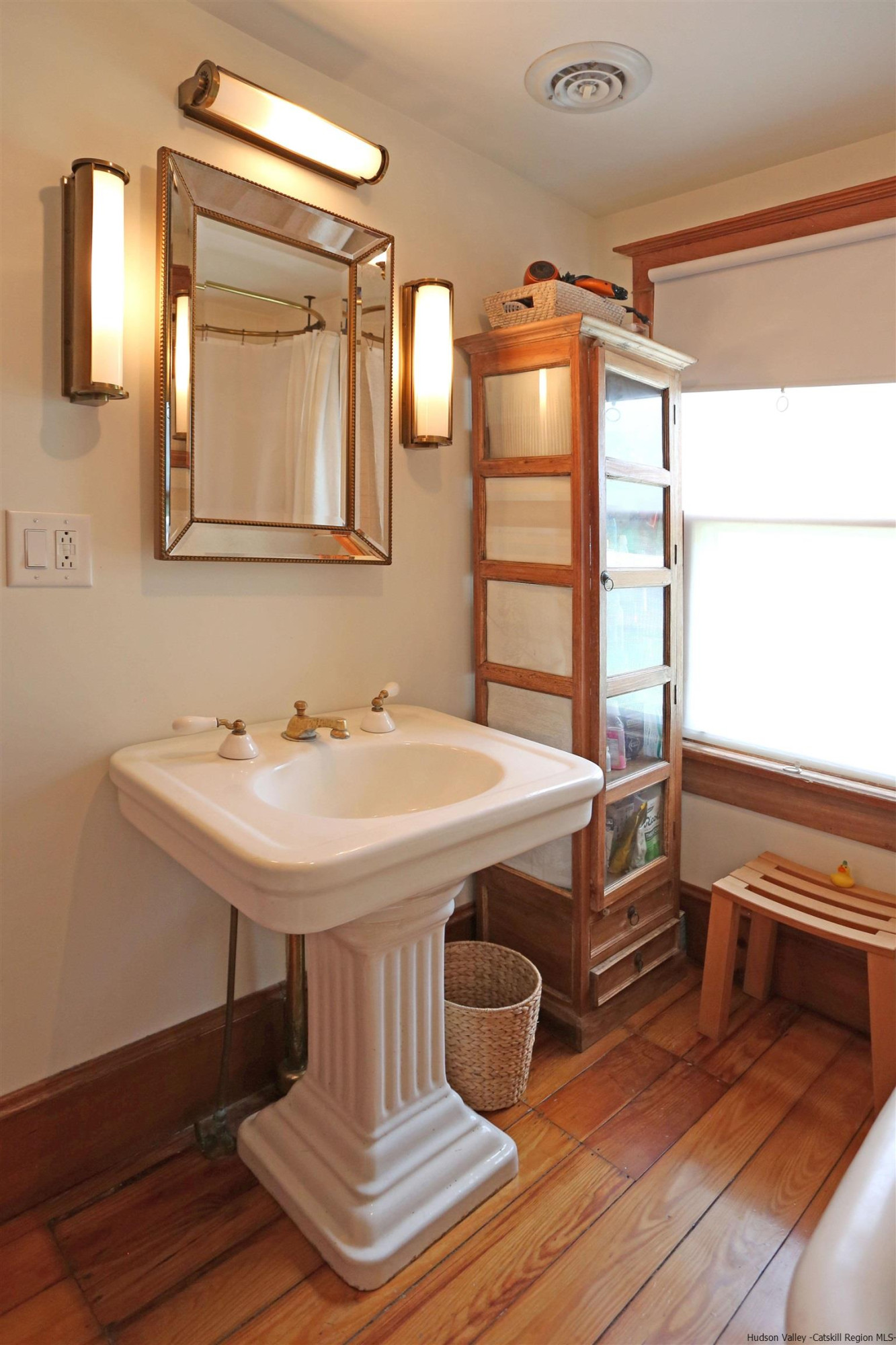 122 Peak Road Stone Ridge, NY 12484 - Photo 11 of 35 a bathroom with a sink and a mirror