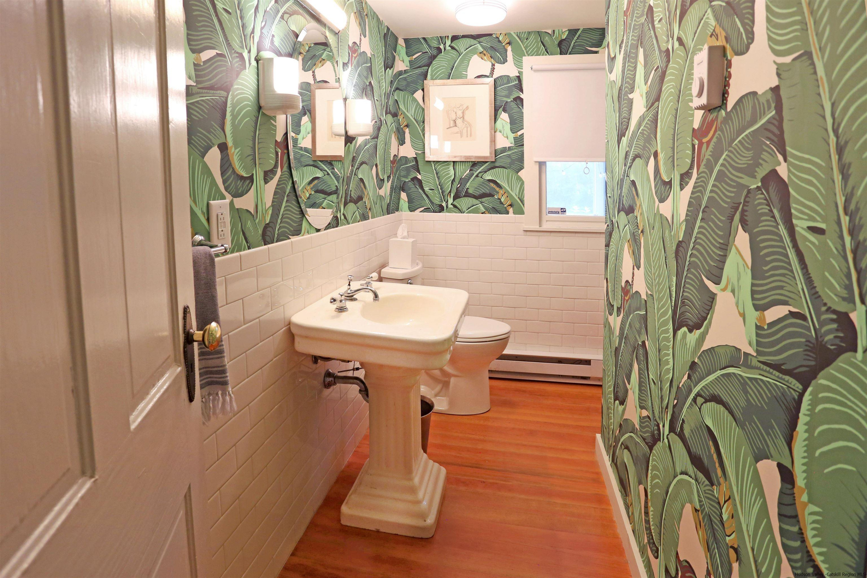 122 Peak Road Stone Ridge, NY 12484 - Photo 19 of 35 a view of a bathroom with a sink and mirror