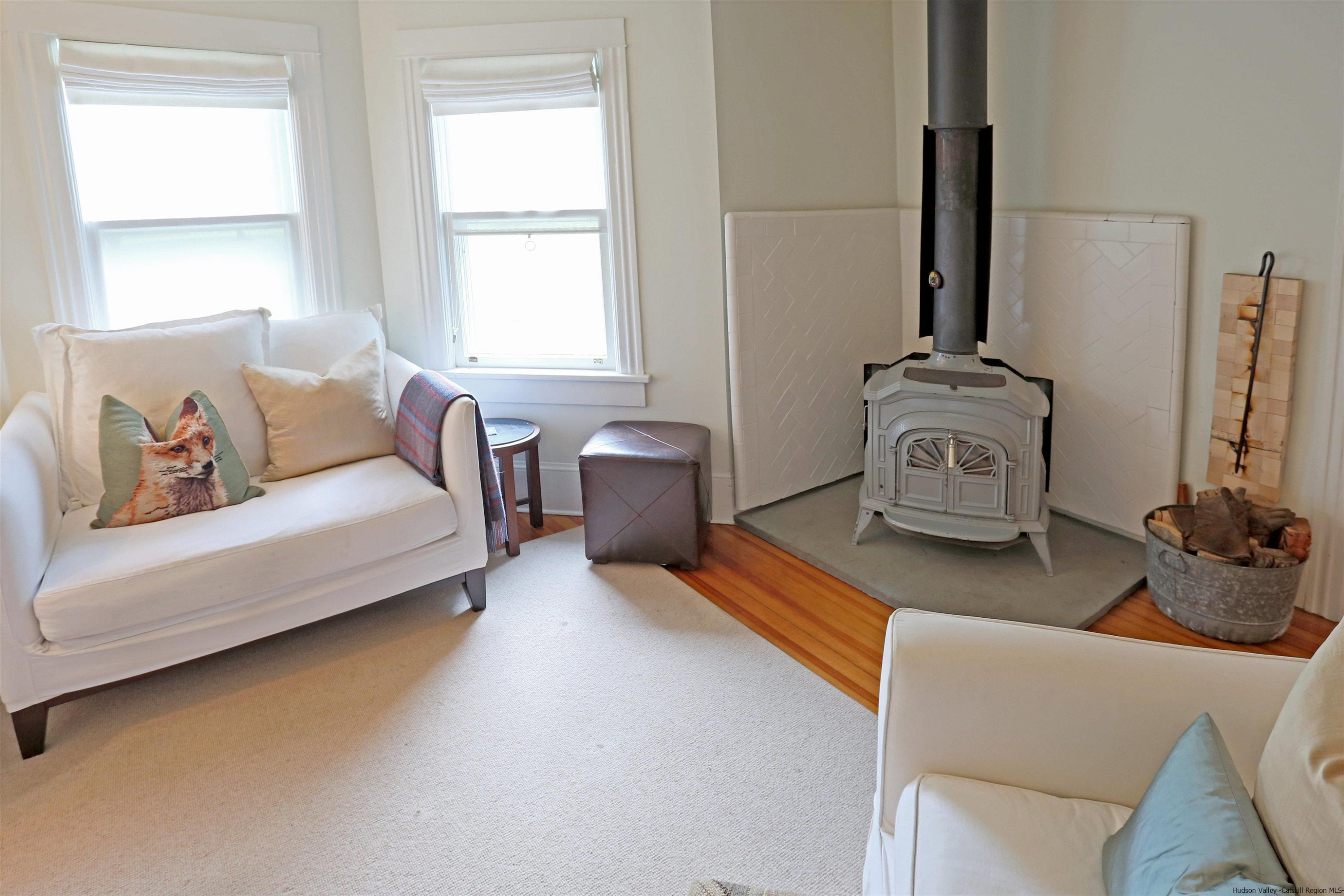 122 Peak Road Stone Ridge, NY 12484 - Photo 21 of 35 a living room with furniture and a flat screen tv