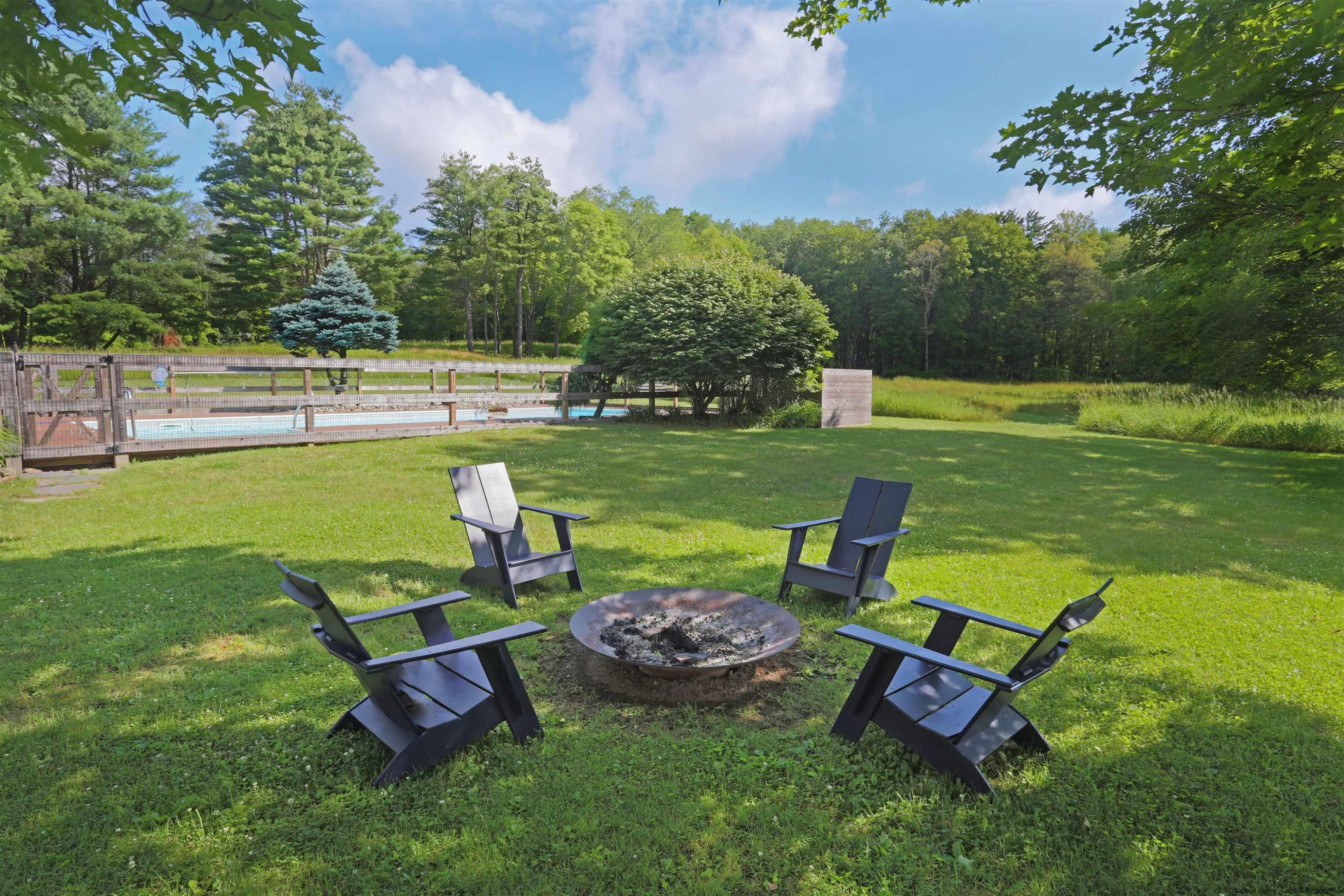 122 Peak Road Stone Ridge, NY 12484 - Photo 25 of 35 a view of a swimming pool and lounge chairs in back yard