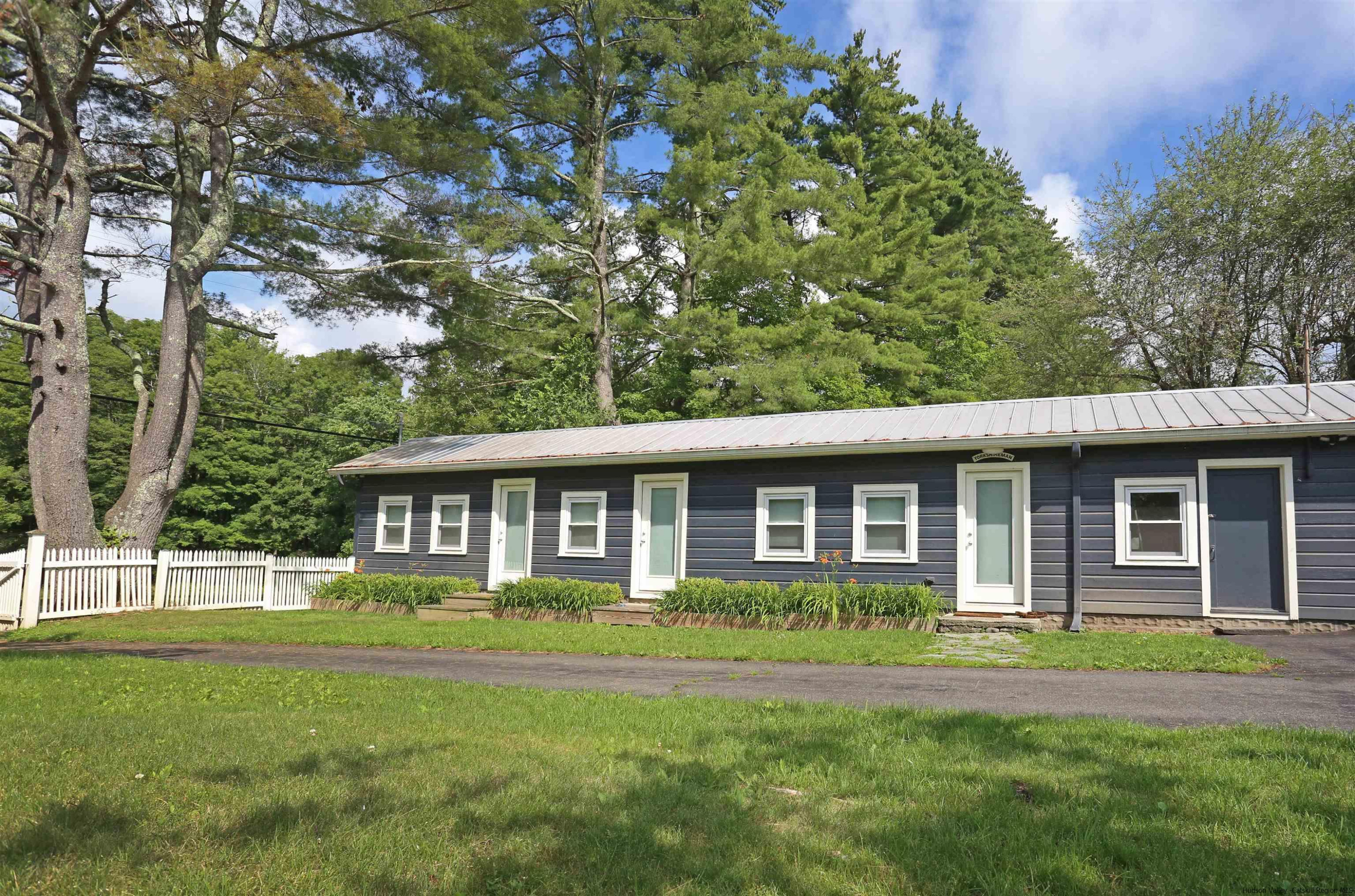 122 Peak Road Stone Ridge, NY 12484 - Photo 31 of 35 a front view of a house with a garden