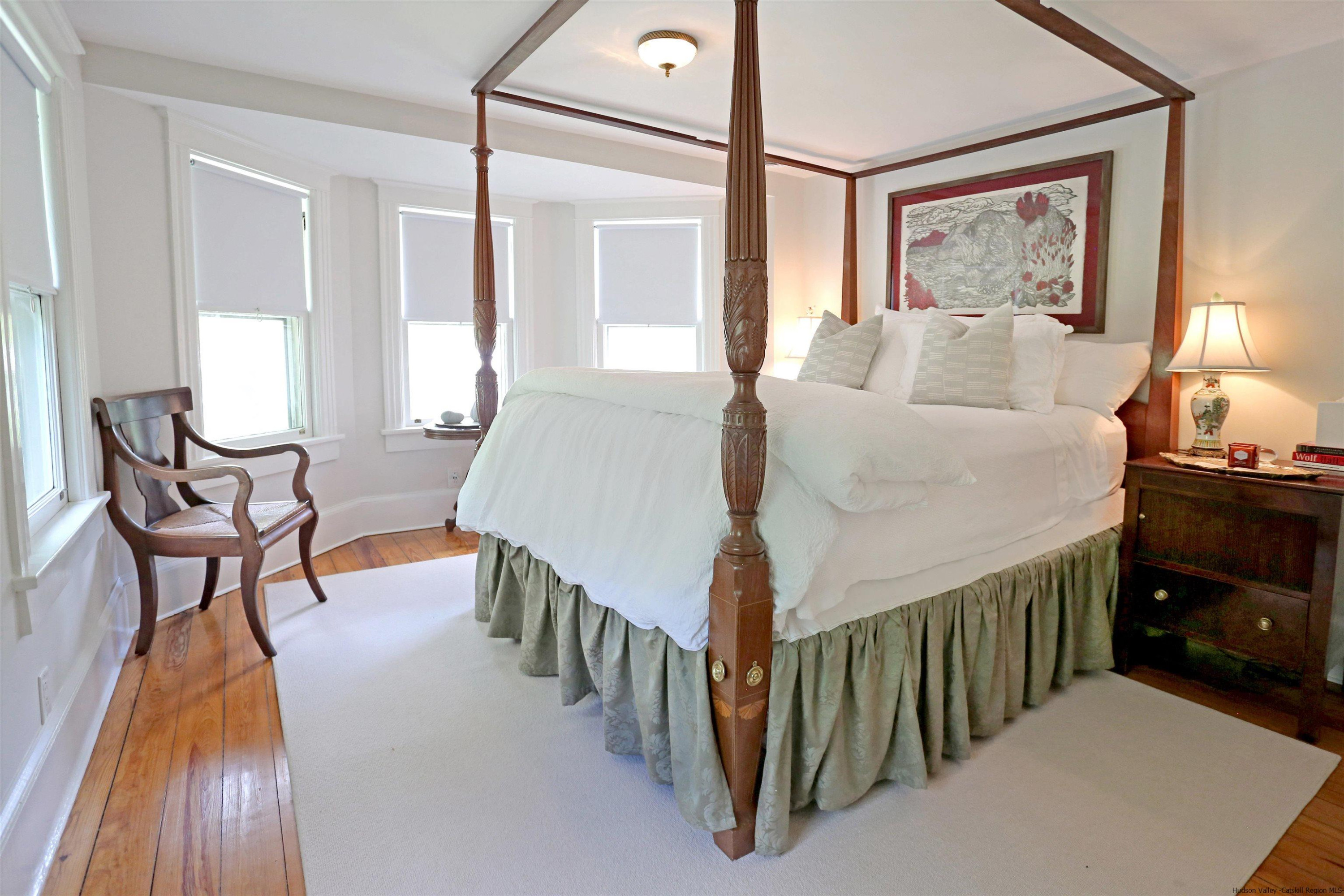 122 Peak Road Stone Ridge, NY 12484 - Photo 9 of 35 a bedroom with furniture and a wooden floor