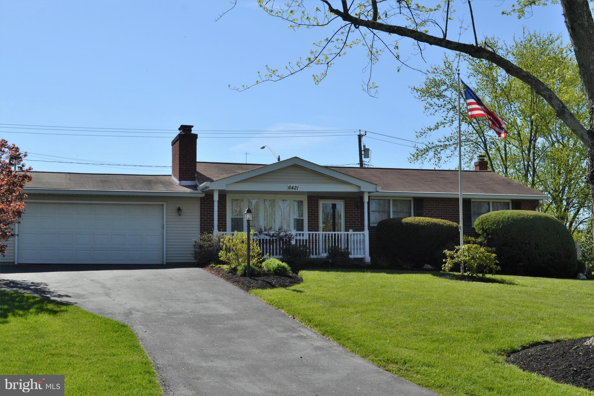 6421 Chell Road Columbia, MD 21044 - Photo 1 of 25 a front view of a house with a garden and plants