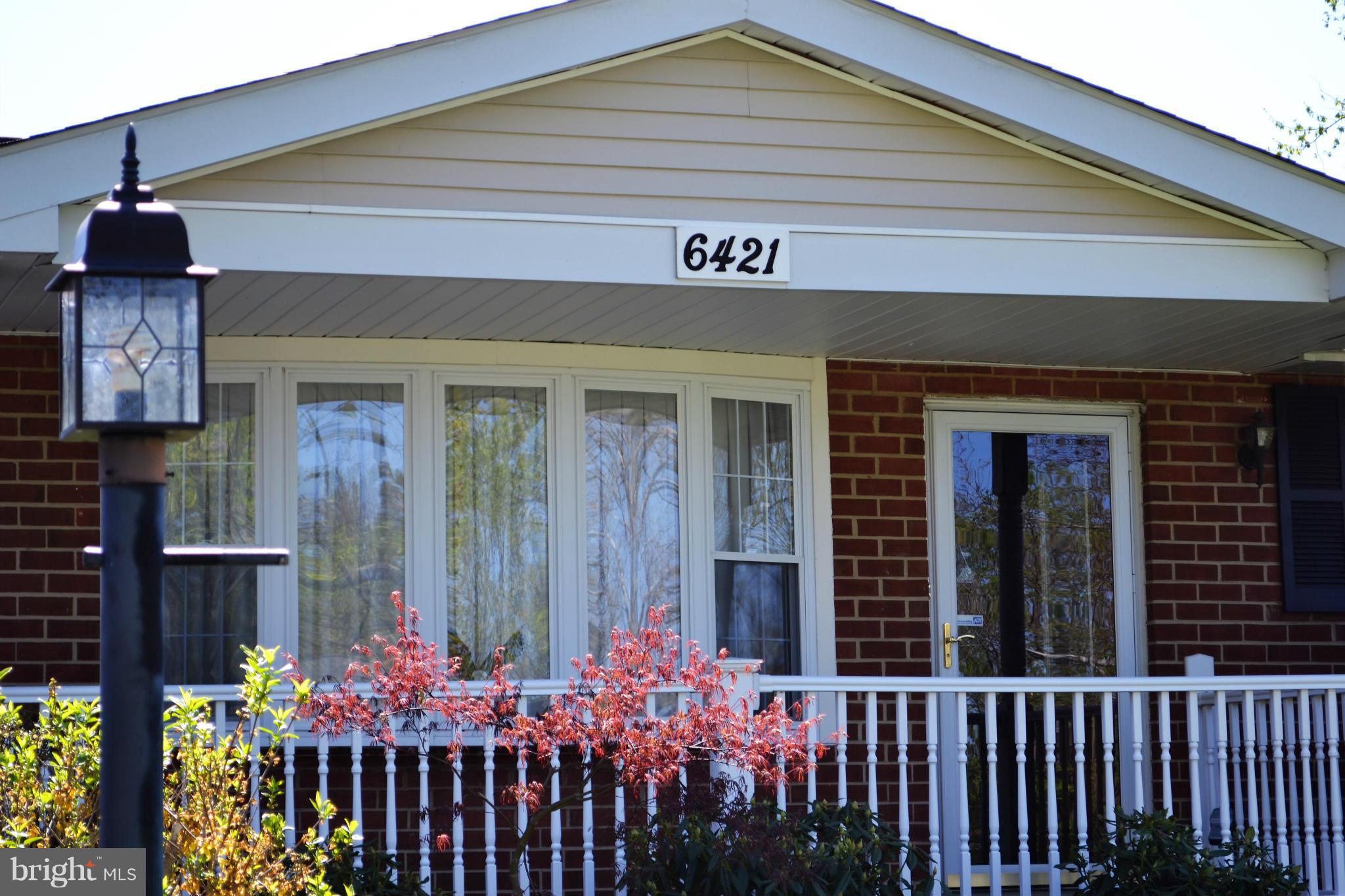 6421 Chell Road Columbia, MD 21044 - Photo 2 of 25 a front view of a house with a garden
