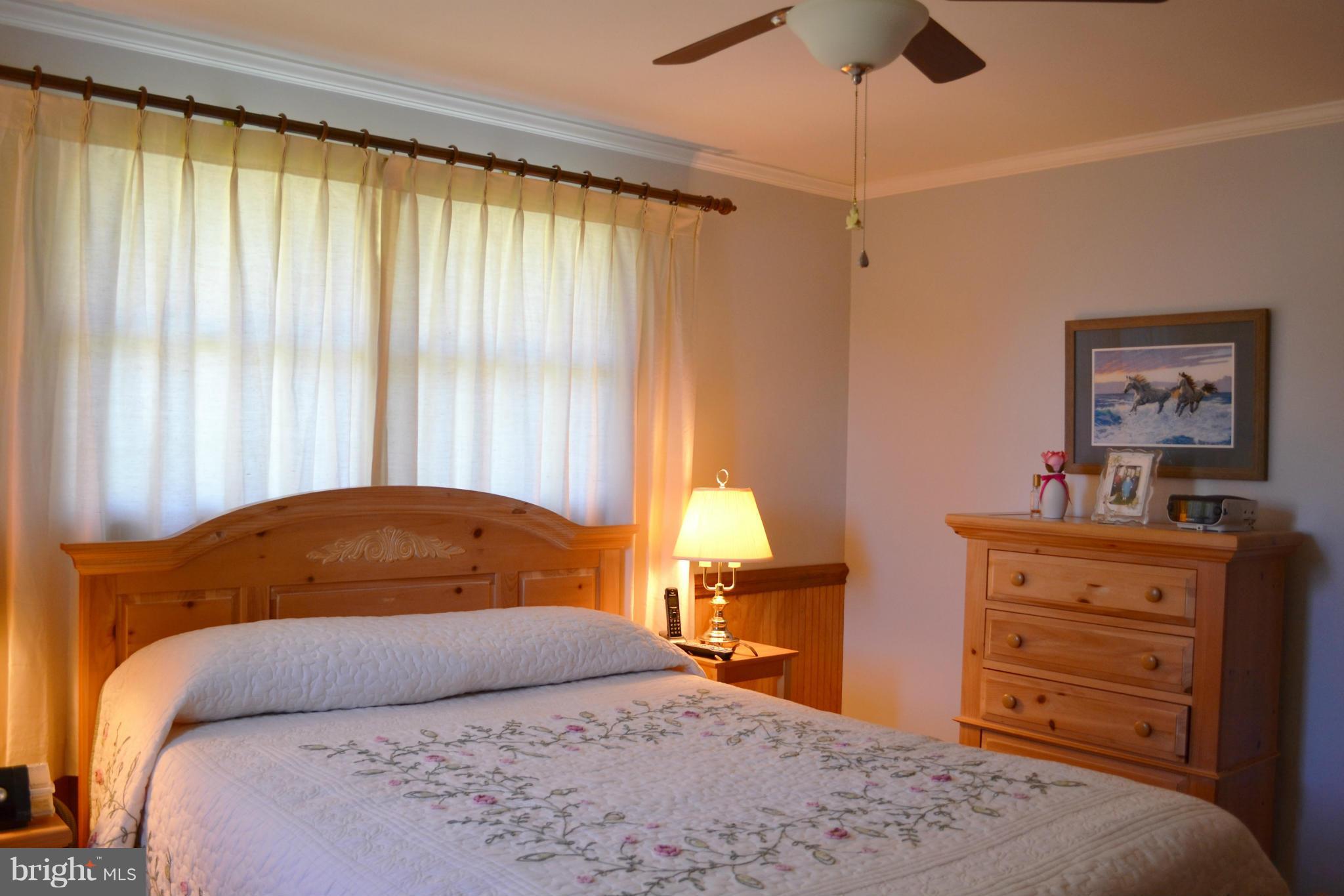 6421 Chell Road Columbia, MD 21044 - Photo 12 of 25 a bedroom with a bed and a dresser