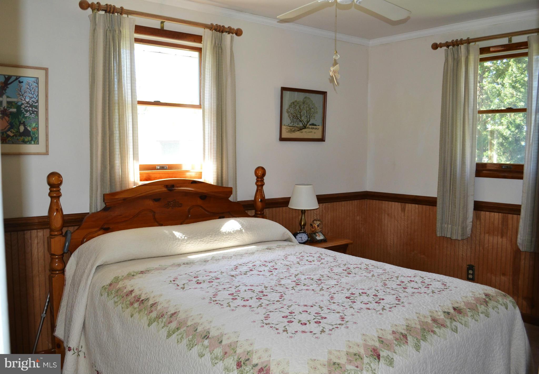 6421 Chell Road Columbia, MD 21044 - Photo 13 of 25 a bedroom with bed and window