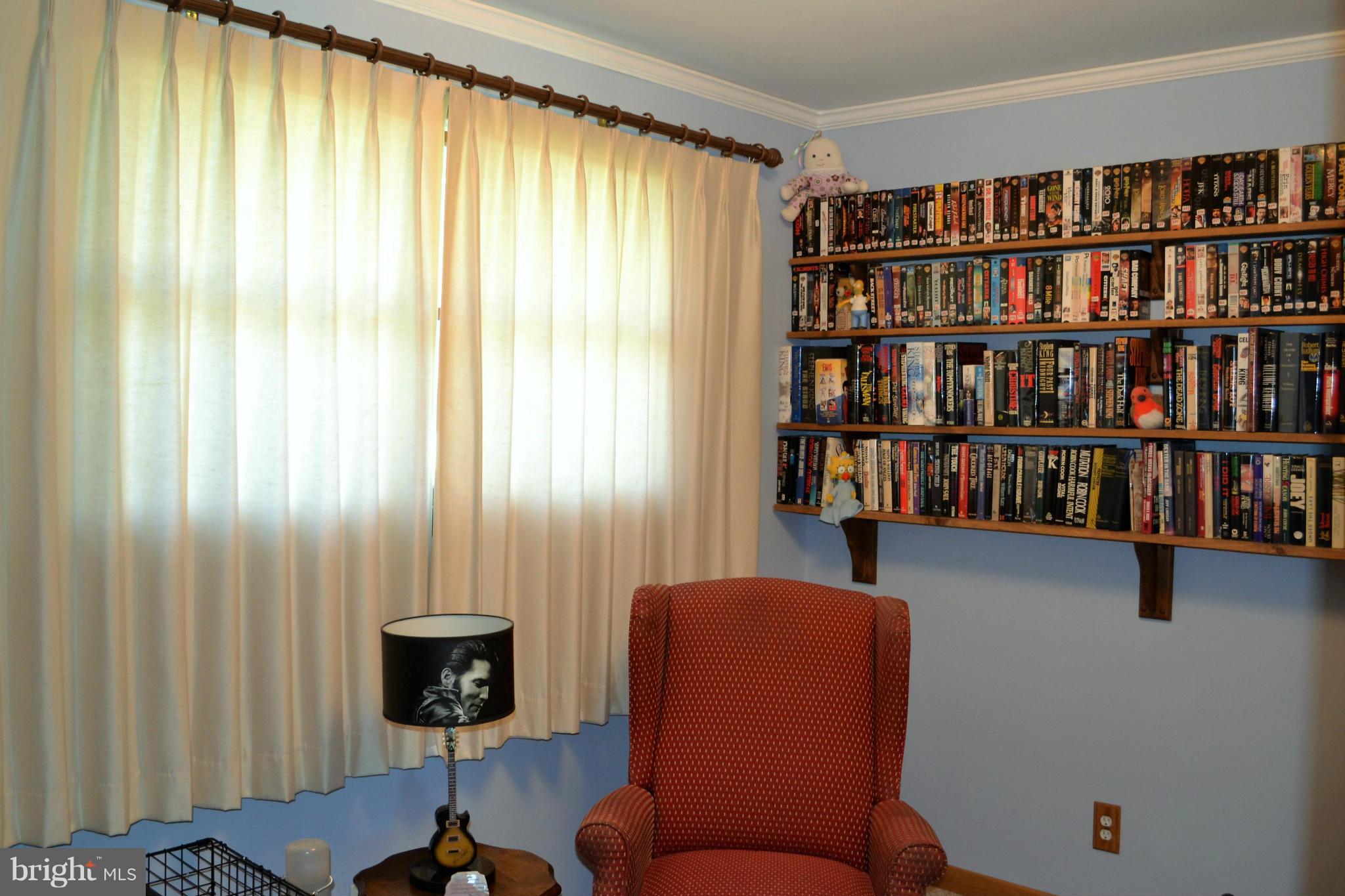 6421 Chell Road Columbia, MD 21044 - Photo 14 of 25 a view of a livingroom with furniture and a bookshelf